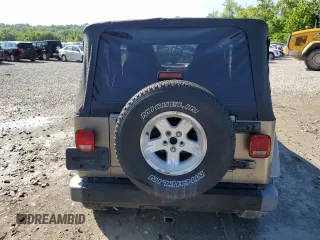 2004 Jeep Wrangler Sahara with VIN 1J4FA59S14P755450, listed as a Copart auction lot 58558005 with 194,044 mi miles and Salvage title. Bid and sale history available at DreamBid. Image 6.