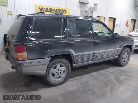 1995 Jeep Grand Cherokee Laredo with VIN 1J4GZ58S6SC765863, listed as a IAAI auction lot 41797726 with 234,715 mi miles and . Bid and sale history available at DreamBid. Image 4.