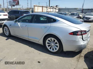 2017 Tesla Model S 60 with VIN 5YJSA1E17HF189627, listed as a Copart auction lot 64454635 with 106,003 mi miles and Salvage title. Bid and sale history available at DreamBid. Image 2.