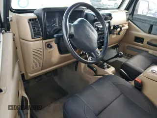 1999 Jeep Wrangler Sahara with VIN 1J4FY49SXXP414414, listed as a Copart auction lot 41643665 with 154,810 mi miles and Salvage Title. Bid and sale history available at carsss.com. Image 8.