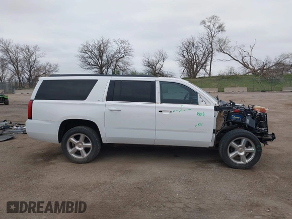 2015 Chevrolet Suburban LT with VIN 1GNSKJKC7FR547276, listed as a IAAI auction lot 42041289 with 189,075 mi miles and . Bid and sale history available at DreamBid. Image 14.