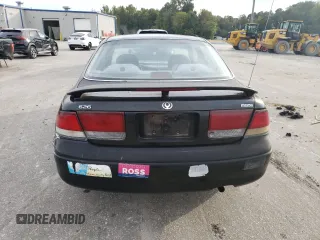 1996 Mazda 626 z VIN 1YVGE22C2T5585359, wystawiony jako Copart lot #74568444 z przebiegiem 159 922 mil mil oraz Szkody całkowita. Historia ofert i sprzedaży dostępna na DreamBid. Obrazek 6.