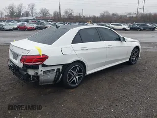 2014 Mercedes-Benz E 550 Sport with VIN WDDHF9BBXEA940995, listed as a IAAI auction lot 41872452 with 50,451 mi miles and . Bid and sale history available at DreamBid. Image 4.