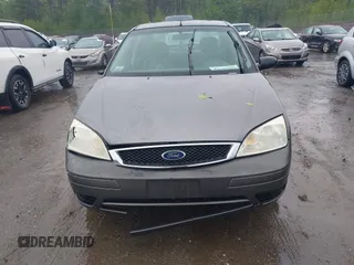 2007 Ford Focus S z VIN 1FAFP34N77W336075, wystawiony jako IAAI lot #42325783 z przebiegiem 153 194 mil mil oraz . Historia ofert i sprzedaży dostępna na DreamBid. Obrazek 12.