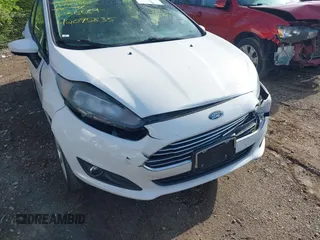2019 Ford Fiesta SE z VIN 3FADP4BJ9KM136689, wystawiony jako IAAI lot #42095835 z przebiegiem 80 856 mil mil oraz . Historia ofert i sprzedaży dostępna na DreamBid. Obrazek 6.