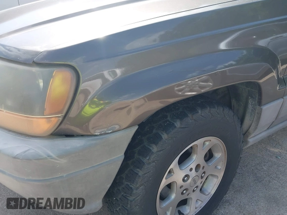 1999 Jeep Grand Cherokee Laredo with VIN 1J4GW58S2XC524365, listed as a IAAI auction lot 42432625 with 284,942 mi miles and . Bid and sale history available at DreamBid. Image 6.