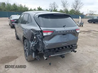 2021 Ford Escape SE z VIN 1FMCU0G62MUA94307, wystawiony jako IAAI lot #42018728 z przebiegiem 142 662 mil mil oraz . Historia ofert i sprzedaży dostępna na DreamBid. Obrazek 3.