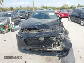 2023 Mazda 3 Premium Plus z VIN JM1BPBNY0P1615814, wystawiony jako IAAI lot #41718577 z przebiegiem Nie podano mil oraz . Historia ofert i sprzedaży dostępna na DreamBid. Obrazek 12.