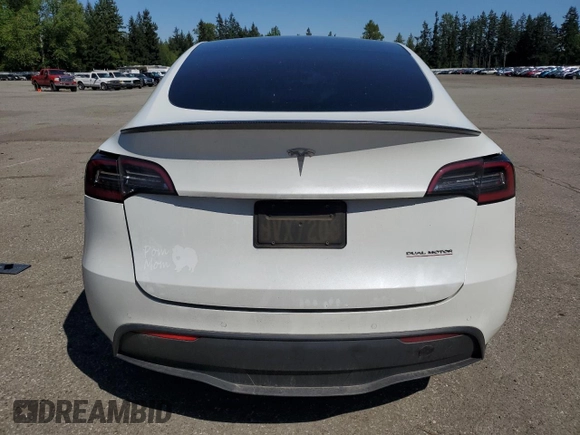 2020 Tesla Model Y Long Range with VIN 5YJYGDEF9LF023060, listed as a Copart auction lot 55462395 with 58,211 mi miles and Salvage Title. Bid and sale history available at DreamBid. Image 6.