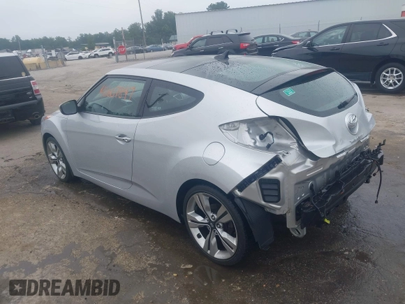 2012 Hyundai Veloster w/Black Int with VIN KMHTC6AD1CU034787, listed as a IAAI auction lot 42607847 with 126,912 mi miles and . Bid and sale history available at DreamBid. Image 3.