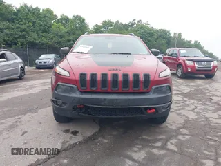 2015 Jeep Cherokee Trailhawk with VIN 1C4PJMBSXFW667469, listed as a IAAI auction lot 42438006 with 127,136 mi miles and . Bid and sale history available at DreamBid. Image 6.