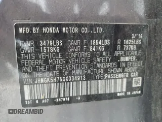 2016 Honda Fit EX with VIN JHMGK5H75GX034913, listed as a Copart auction lot 63948425 with 106,684 mi miles and Salvage title. Bid and sale history available at DreamBid. Image 12.