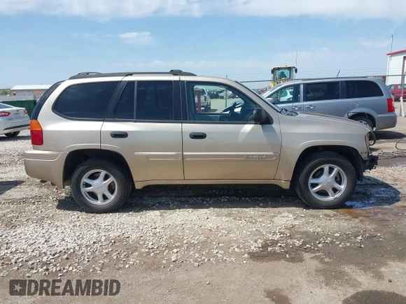 2005 GMC Envoy SLE with VIN 1GKDT13S252264932, listed as a IAAI auction lot 41981566 with 140,566 mi miles. Bid and sale history available at carsss.com. Image 14.