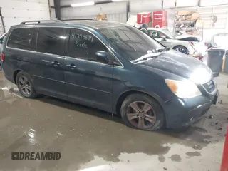 2010 Honda Odyssey Touring with VIN 5FNRL3H98AB095042, listed as a IAAI auction lot 41394894 with 254,525 mi miles. Bid and sale history available at carsss.com. Image 1.