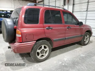 1999 Suzuki Vitara JX z VIN 2S3TD52V4X6110057, wystawiony jako Copart lot #87752215 z przebiegiem 245 419 mil mil oraz Szkody całkowita. Historia ofert i sprzedaży dostępna na DreamBid. Obrazek 3.