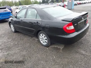 2003 Toyota Camry LE z VIN 4T1BF30KX3U049919, wystawiony jako IAAI lot #42148543 z przebiegiem 208 140 mil mil oraz . Historia ofert i sprzedaży dostępna na DreamBid. Obrazek 3.