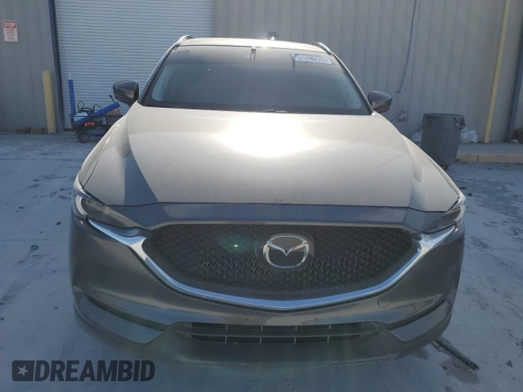 2021 Mazda CX-5 Grand Touring with VIN JM3KFBDM0M1464817, listed as a Copart auction lot 48821965 with 53,648 mi miles and Clean Title. Bid and sale history available at carsss.com. Image 5.