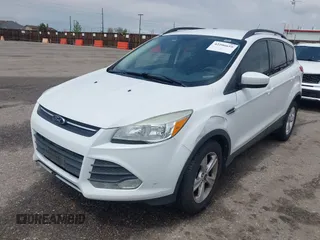 2014 Ford Escape SE with VIN 1FMCU9GX6EUD51032, listed as a IAAI auction lot 42206659 with 131,438 mi miles and . Bid and sale history available at DreamBid. Image 2.