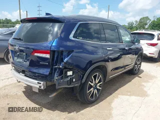 2022 Honda Pilot Touring 7-Passenger with VIN 5FNYF5H61NB019768, listed as a IAAI auction lot 42438780 with Not provided miles and . Bid and sale history available at DreamBid. Image 4.