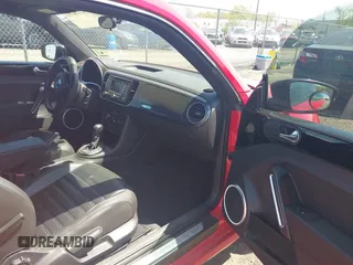 2012 Volkswagen Beetle 2.0T Turbo w/Sun/Snd/Nav PZEV with VIN 3VWVA7AT4CM608798, listed as a IAAI auction lot 42130353 with 152,052 mi miles. Bid and sale history available at carsss.com. Image 5.