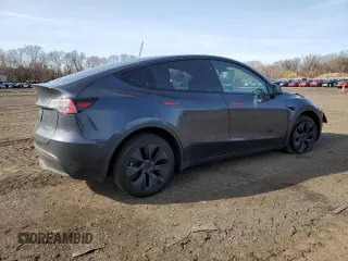 2025 Tesla Model Y Long Range with VIN 7SAYGDEE4SF291068, listed as a Copart auction lot 51204615 with 2,958 mi miles and Salvage Title. Bid and sale history available at DreamBid. Image 3.