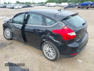 2014 Ford Focus Titanium with VIN 1FADP3N25EL194433, listed as a IAAI auction lot 42512912 with 105,355 mi miles and . Bid and sale history available at DreamBid. Image 3.