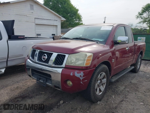 2004 Nissan Titan SE with VIN 1N6AA06A94N545539, listed as a IAAI auction lot 42036468 with 212,269 mi miles. Bid and sale history available at carsss.com. Image 2.