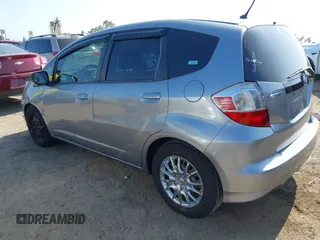 2009 Honda Fit with VIN JHMGE88239S025012, listed as a IAAI auction lot 42584028 with 163,965 mi miles and . Bid and sale history available at DreamBid. Image 3.