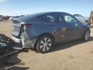 2023 Tesla Model Y Long Range z VIN 7SAYGDEE7PF965446, wystawiony jako Copart lot #54710375 z przebiegiem 23 807 mil mil oraz Szkoda całkowita • Salvage title. Historia ofert i sprzedaży dostępna na DreamBid. Obrazek 3.