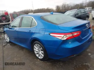 2020 Toyota Camry LE with VIN 4T1C11AK7LU324006, listed as a IAAI auction lot 41486878 with 76,290 mi miles. Bid and sale history available at carsss.com. Image 3.