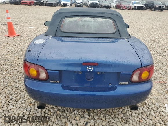 1999 Mazda MX-5 Miata with VIN JM1NB3532X0134801, listed as a Copart auction lot 83838374 with 97,015 mi miles and Salvage title. Bid and sale history available at DreamBid. Image 6.