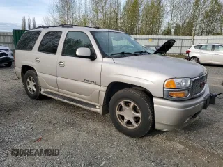 2005 GMC Yukon Denali z VIN 1GKEK63U65J262371, wystawiony jako Copart lot #52773425 z przebiegiem 129 028 mil mil oraz Czysty tytuł • Clean title. Historia ofert i sprzedaży dostępna na DreamBid. Obrazek 4.