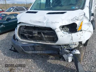 2016 Ford Transit Cargo with VIN 1FTYR1ZM2GKA38963, listed as a IAAI auction lot 42027447 with 70,659 mi miles and . Bid and sale history available at DreamBid. Image 6.