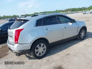 2014 Cadillac SRX Luxury Collection z VIN 3GYFNEE36ES652353, wystawiony jako IAAI lot #42233986 z przebiegiem 146 029 mil mil oraz . Historia ofert i sprzedaży dostępna na DreamBid. Obrazek 4.