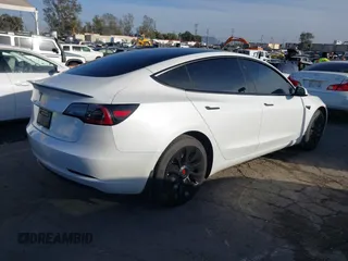2023 Tesla Model 3 with VIN 5YJ3E1EA0PF503352, listed as a IAAI auction lot 41718658 with 28,426 mi miles and . Bid and sale history available at DreamBid. Image 4.