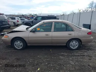 1999 Ford Escort SE with VIN 1FAFP13P3XW253542, listed as a IAAI auction lot 41691407 with 93,221 mi miles. Bid and sale history available at carsss.com. Image 14.