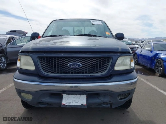 2000 Ford F-150 XL with VIN 1FTRX18L2YKA10388, listed as a IAAI auction lot 41526430 with 144,480 mi miles. Bid and sale history available at carsss.com. Image 12.