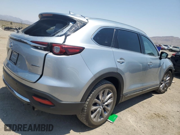 2021 Mazda CX-9 Grand Touring z VIN JM3TCADY4M0512268, wystawiony jako Copart lot #62683464 z przebiegiem Nie podano mil oraz Szkoda całkowita • Salvage title. Historia ofert i sprzedaży dostępna na DreamBid. Obrazek 3.