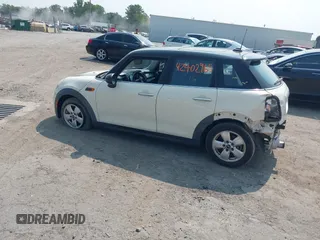 2015 MINI Hardtop 4 Door with VIN WMWXS5C5XFT827330, listed as a IAAI auction lot 42402965 with 140,648 mi miles and . Bid and sale history available at DreamBid. Image 3.