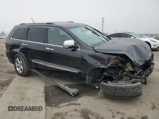 2013 Jeep Grand Cherokee Limited with VIN 1C4RJEBG5DC657005, listed as a Copart auction lot 84101024 with 124,055 mi miles and Salvage Title. Bid and sale history available at carsss.com. Image 4.