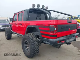 2020 Jeep Gladiator Rubicon with VIN 1C6JJTBG4LL178260, listed as a IAAI auction lot 42602460 with 61,899 mi miles and . Bid and sale history available at DreamBid. Image 3.