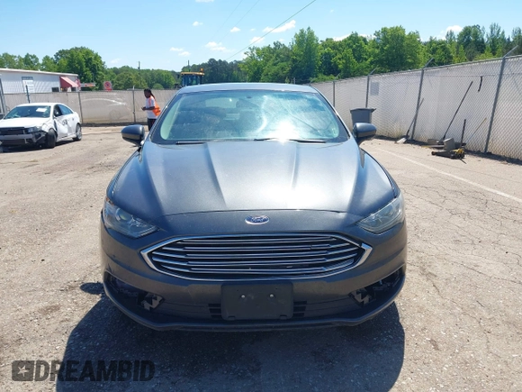 2018 Ford Fusion SE z VIN 3FA6P0H71JR155221, wystawiony jako IAAI lot #42145081 z przebiegiem 189 367 mil mil oraz . Historia ofert i sprzedaży dostępna na DreamBid. Obrazek 13.