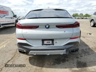2025 BMW X6 M60i with VIN 5UX43EX06S9W68023, listed as a Copart auction lot 69874764 with 3,789 mi miles and Salvage Title. Bid and sale history available at carsss.com. Image 6.