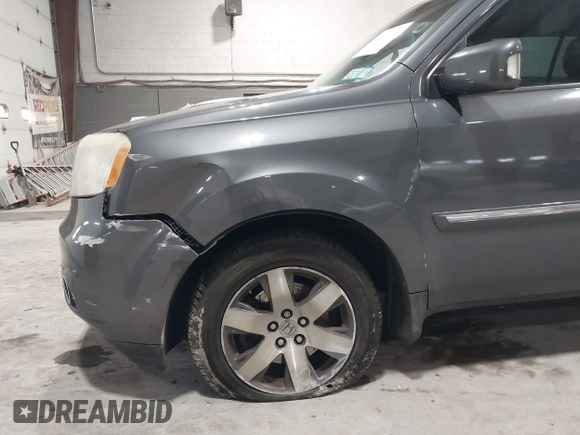 2012 Honda Pilot Touring with VIN 5FNYF4H99CB052034, listed as a IAAI auction lot 42023430 with 137,428 mi miles. Bid and sale history available at carsss.com. Image 6.