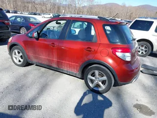 2009 Suzuki SX4 Touring AWD with VIN JS2YB417595100925, listed as a IAAI auction lot 41693882 with 76,972 mi miles and . Bid and sale history available at DreamBid. Image 3.
