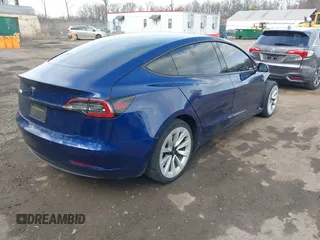 2022 Tesla Model 3 with VIN 5YJ3E1EA7NF188417, listed as a IAAI auction lot 41885623 with 105,457 mi miles and . Bid and sale history available at DreamBid. Image 4.