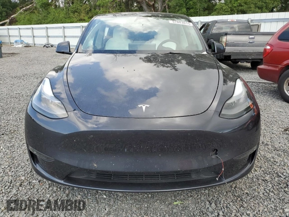 2024 Tesla Model Y Long Range with VIN 7SAYGDEE4RA285620, listed as a Copart auction lot 57883015 with 18,841 mi miles and Salvage title. Bid and sale history available at DreamBid. Image 5.