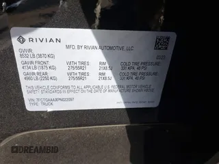 2023 Rivian R1T Adventure with VIN 7FCTGAAAXPN022097, listed as a IAAI auction lot 41235625 with 11,210 mi miles. Bid and sale history available at carsss.com. Image 9.