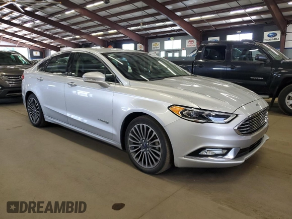 2017 Ford Fusion Hybrid Titanium z VIN 3FA6P0RU1HR300370, wystawiony jako Copart lot #65206605 z przebiegiem 150 424 mil mil oraz Czysty tytuł • Clean title. Historia ofert i sprzedaży dostępna na DreamBid. Obrazek 4.