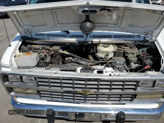 1995 Chevrolet Chevy Van z VIN 1GBEG25H0SF243534, wystawiony jako Copart lot #64175964 z przebiegiem 134 916 mil mil oraz Szkoda całkowita • Salvage title. Historia ofert i sprzedaży dostępna na DreamBid. Obrazek 12.